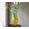 The vase is mouth blown by Indian artisans and made from recycled glass. 